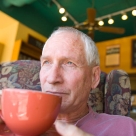 Senior man drinking coffee in cafe